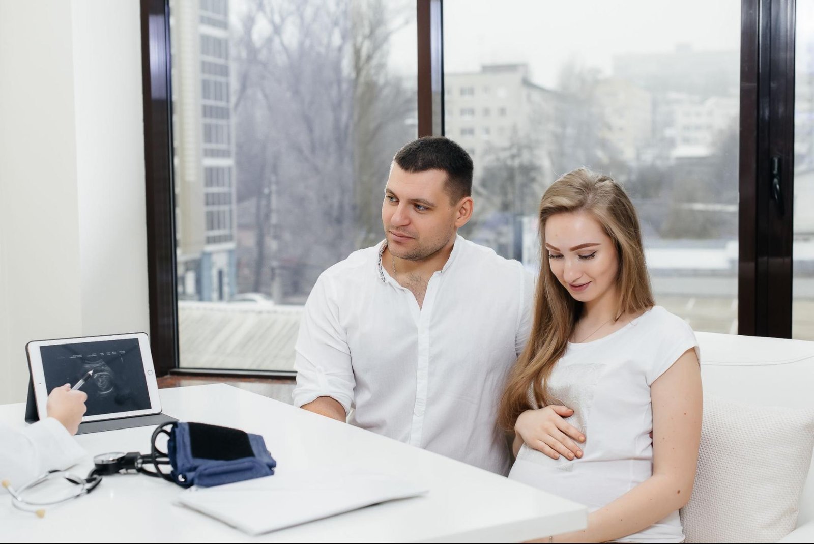 Couple meeting fertility specialist for IVF consultation