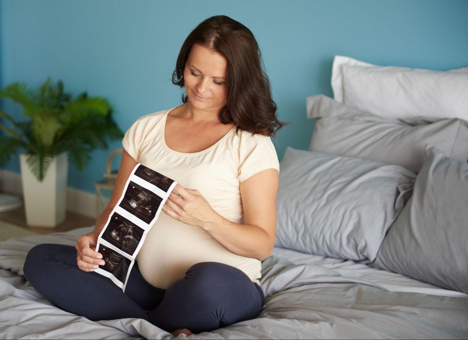 Mother holding child while consulting fertility doctor