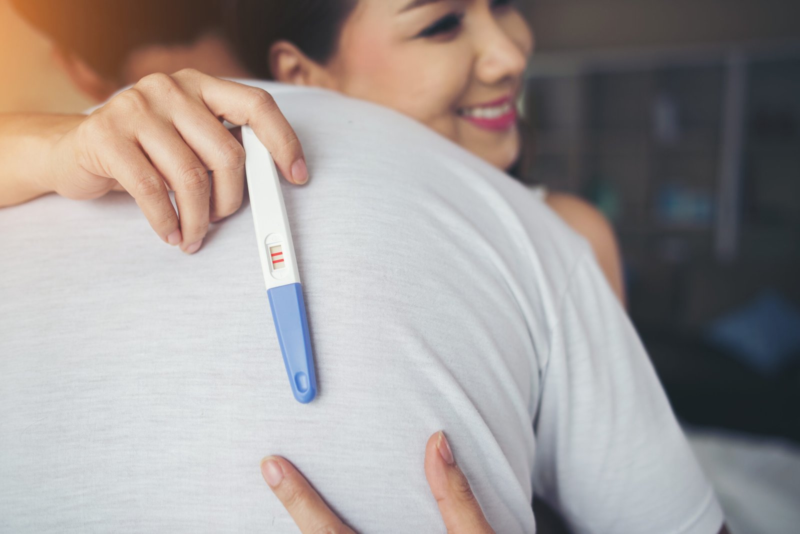 Woman using an ovulation test kit to track fertility 