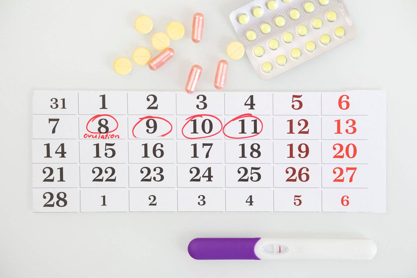 Woman using an ovulation test kit to track fertility