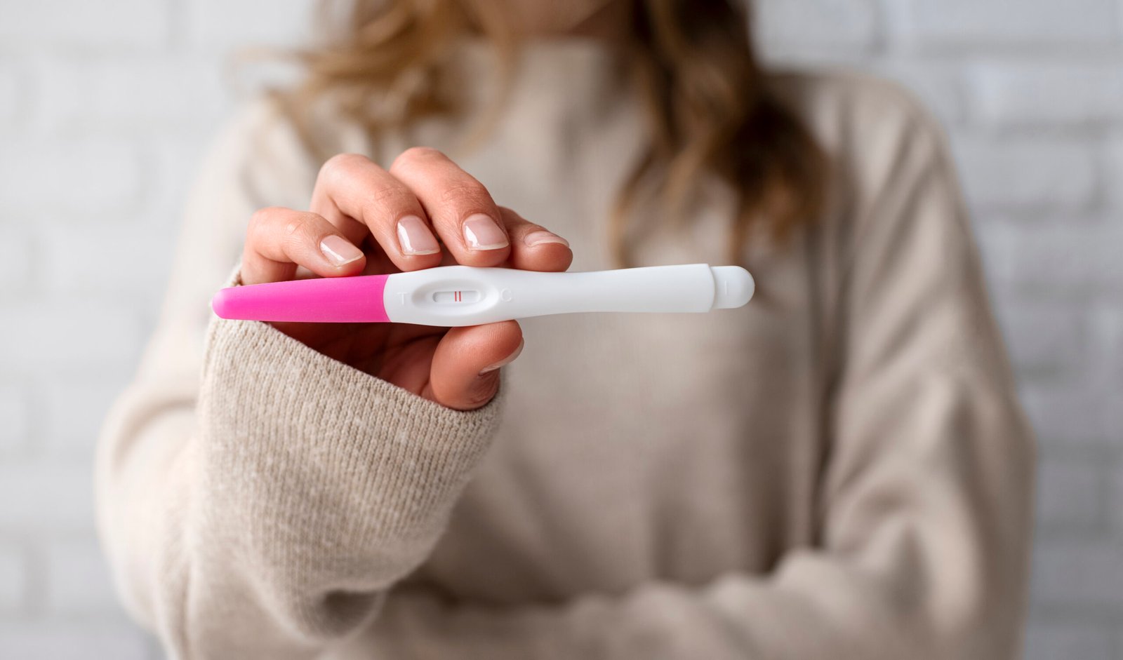 Woman using an ovulation test kit to track fertility 
