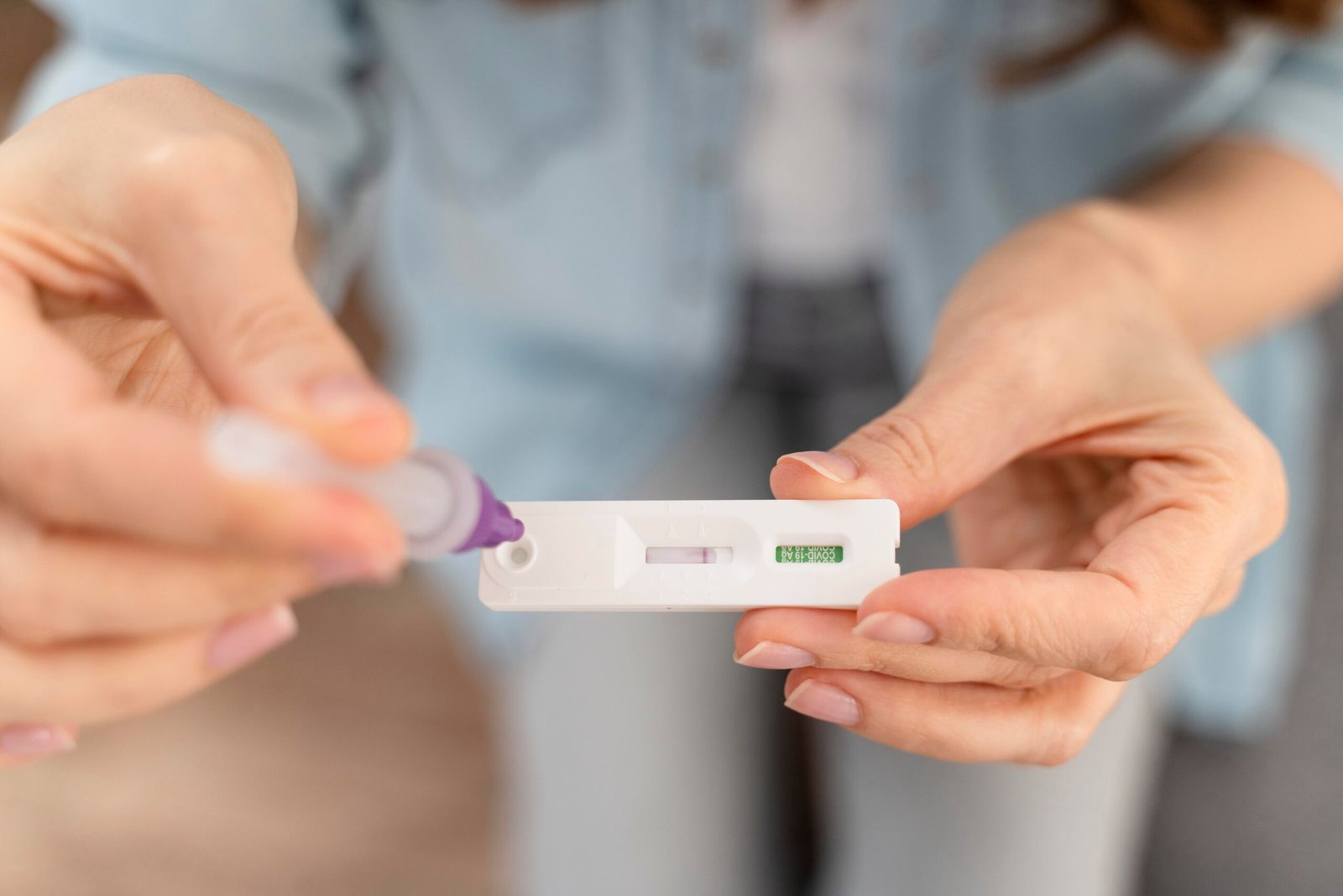 Woman using an ovulation test kit to track fertility
